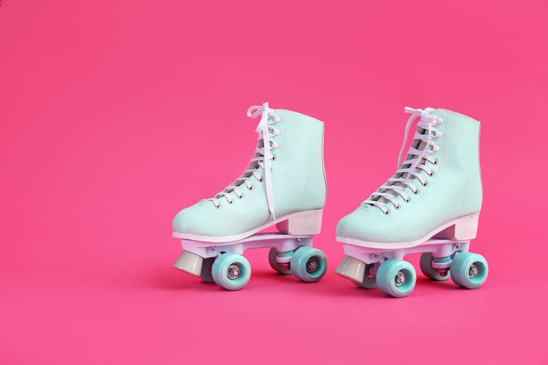 Vintage Roller Skates on Color Background