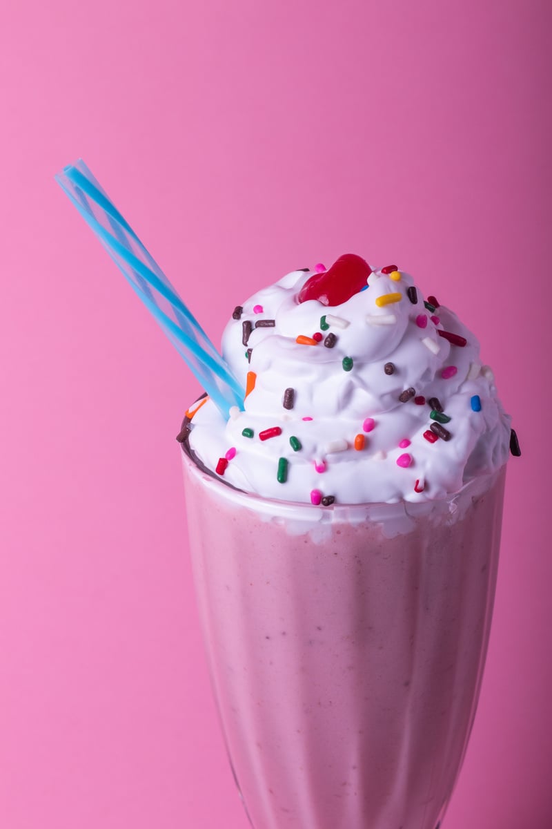 Milkshake with Whip Cream on Pink Background