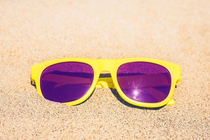 Sunglasses on the shore of the ocean