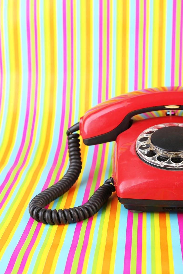 Red Retro Telephone on Bright Background